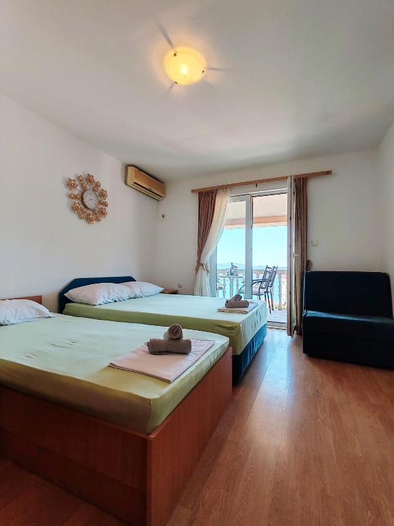 Postel nebo postele na pokoji v ubytování Apartment & Rooms Tempera