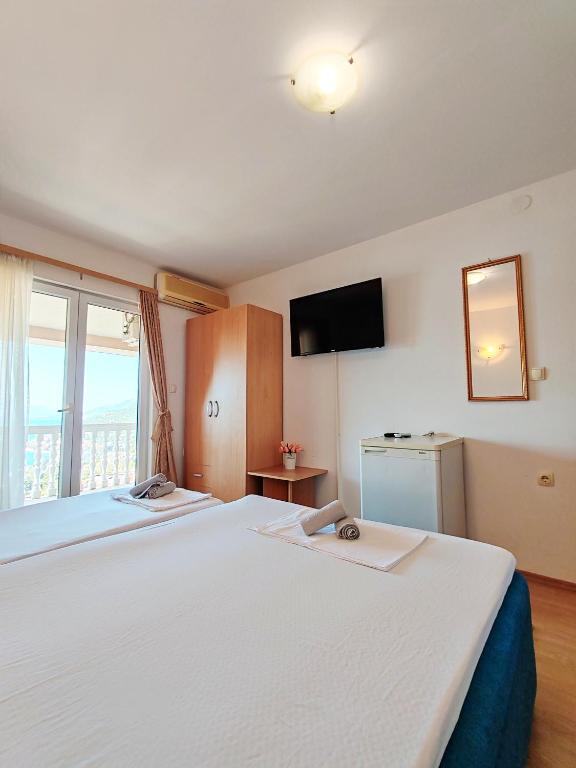 Postel nebo postele na pokoji v ubytování Apartment & Rooms Tempera