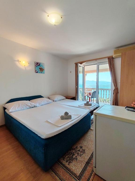 Postel nebo postele na pokoji v ubytování Apartment & Rooms Tempera