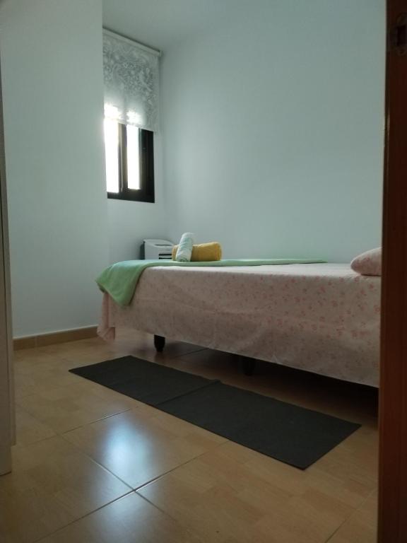 Postel nebo postele na pokoji v ubytování Habitación Ático Sol y Mar