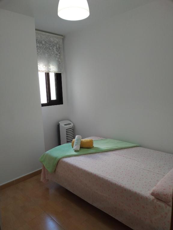 Postel nebo postele na pokoji v ubytování Habitación Ático Sol y Mar