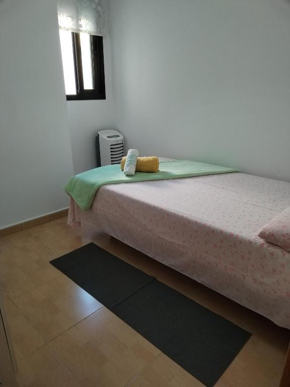 Postel nebo postele na pokoji v ubytování Habitación Ático Sol y Mar