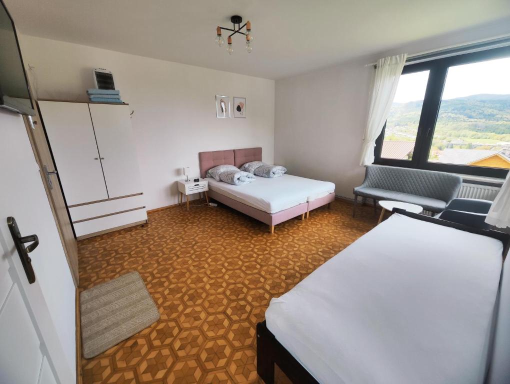 Postel nebo postele na pokoji v ubytování Apartamenty Monterska