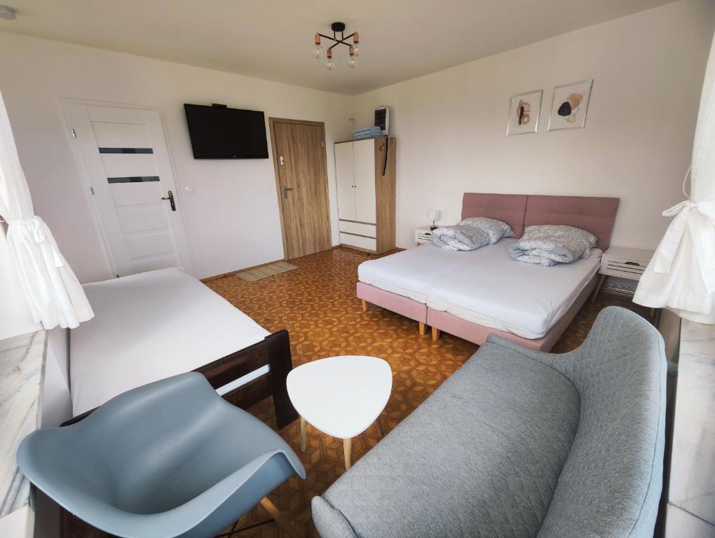 Postel nebo postele na pokoji v ubytování Apartamenty Monterska