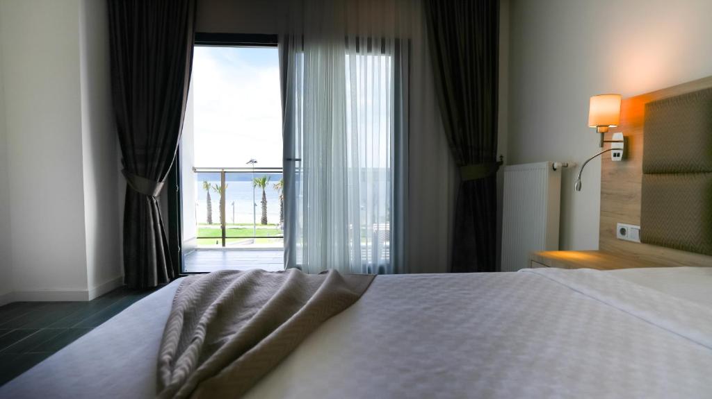 Postel nebo postele na pokoji v ubytování Sunsan Hotel