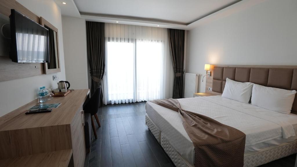 Postel nebo postele na pokoji v ubytování Sunsan Hotel