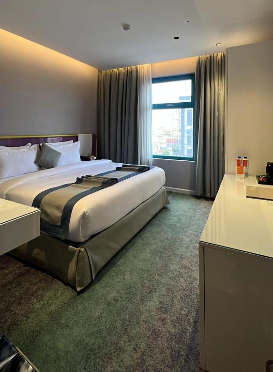 Postel nebo postele na pokoji v ubytování Marvelous Hotel