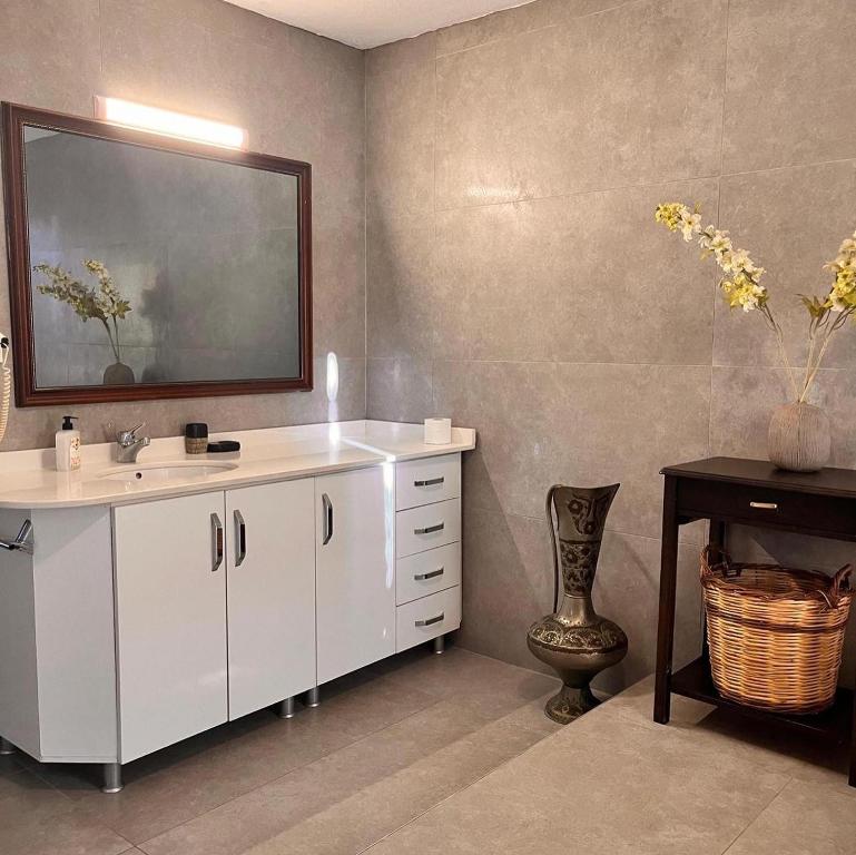 a bathroom with a white sink and a mirror at Villa Sophia Marmaris in Marmaris