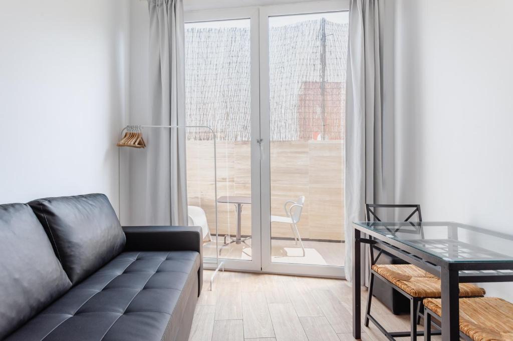Posezení v ubytování CAMP NOU & FiRA BUSINESS LOFTS