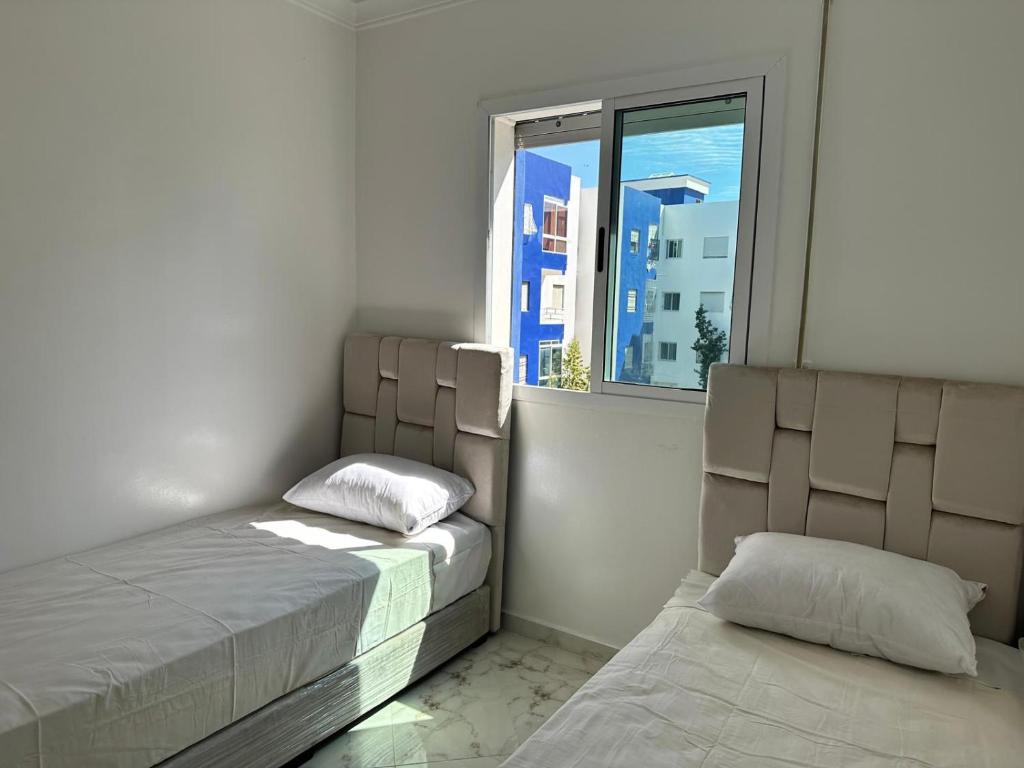 Postel nebo postele na pokoji v ubytování Modern beach appartment in the heart of Martil