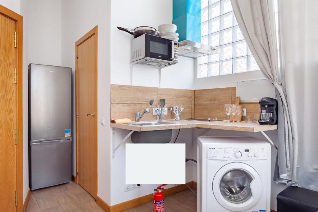 Kuchyň nebo kuchyňský kout v ubytování CAMP NOU & FiRA BUSINESS LOFTS