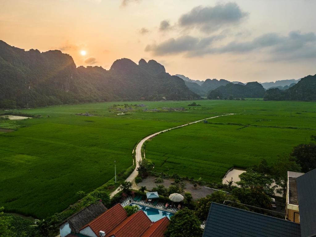 an aerial view of a valley with mountains in the background at Tam Coc Minh Hung Homestay in Ninh Binh