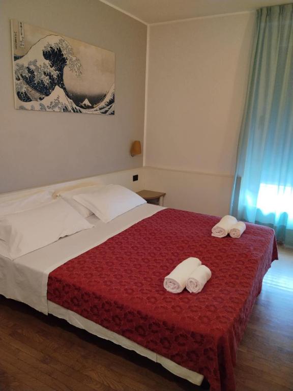 Postel nebo postele na pokoji v ubytování Hotel Xibana
