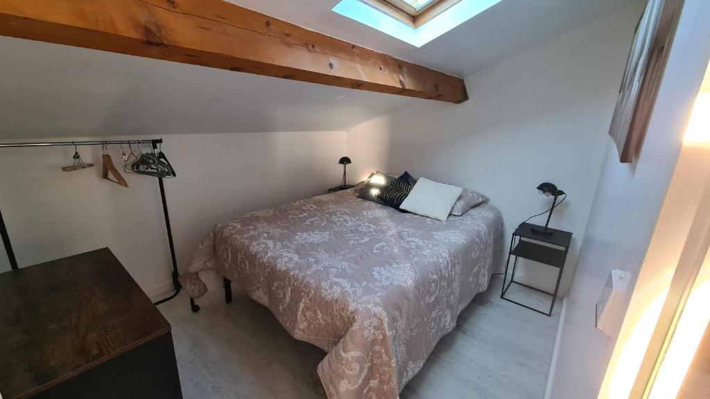 Giường trong phòng chung tại Le Sel du Bonheur