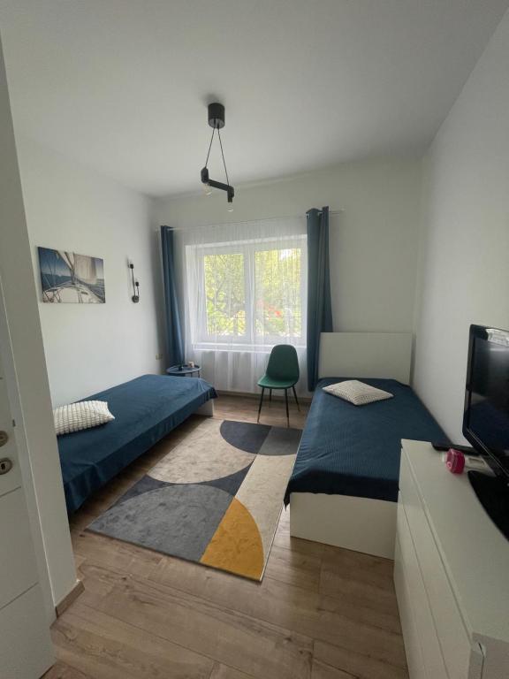 Postel nebo postele na pokoji v ubytování B-Home