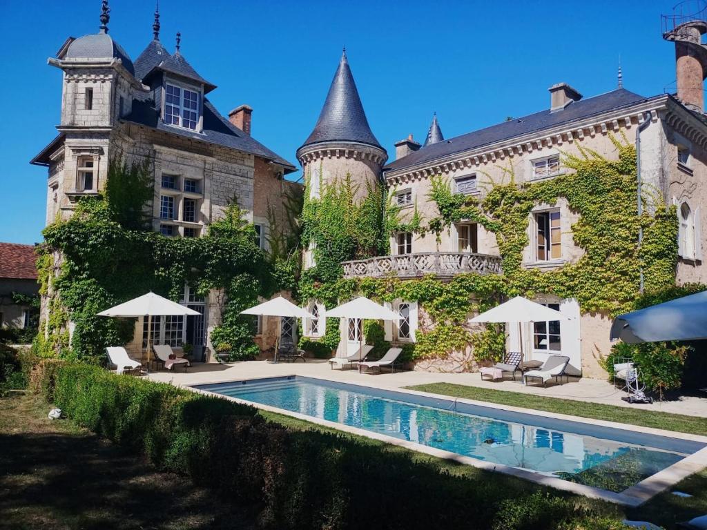 a house with a swimming pool in front of it at Saint Victor La Grand' Maison in Ingrandes