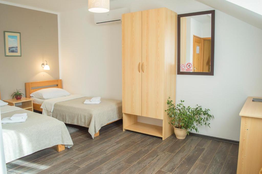 Posteľ alebo postele v izbe v ubytovaní Tourist Center Marko