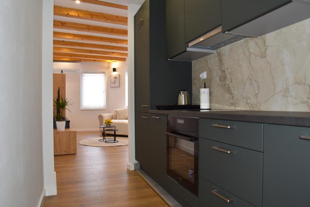 Η κουζίνα ή μικρή κουζίνα στο Apartman TOMA
