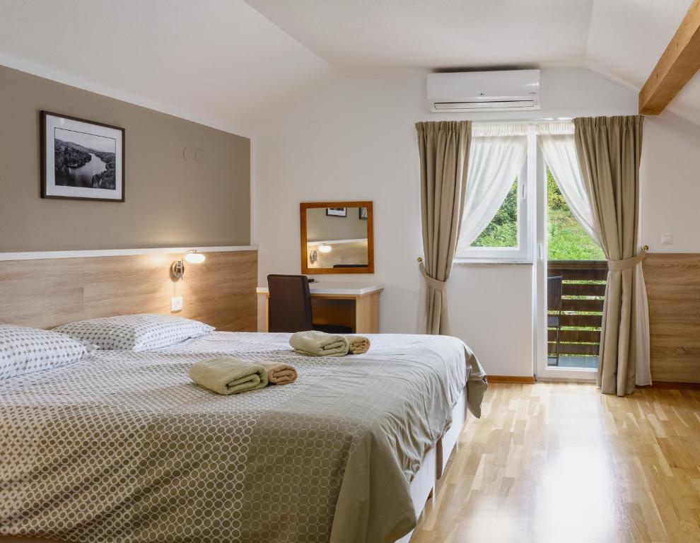Posteľ alebo postele v izbe v ubytovaní Tourist Center Marko