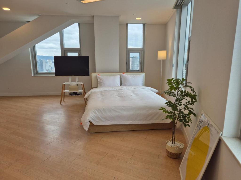 "GRAND OPENED" Maxtyle Guesthouse Dongdaemunにあるベッド