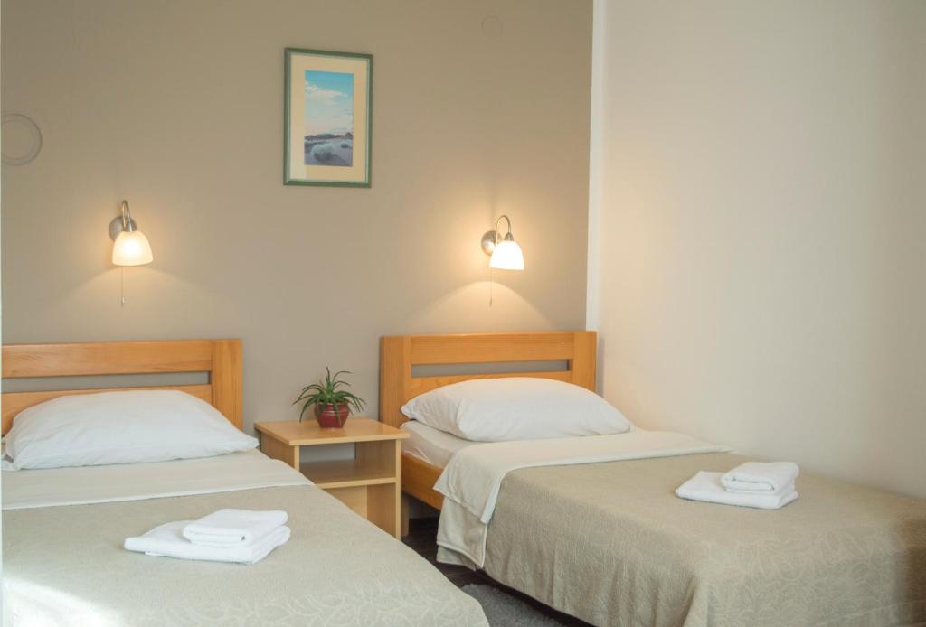 Posteľ alebo postele v izbe v ubytovaní Tourist Center Marko