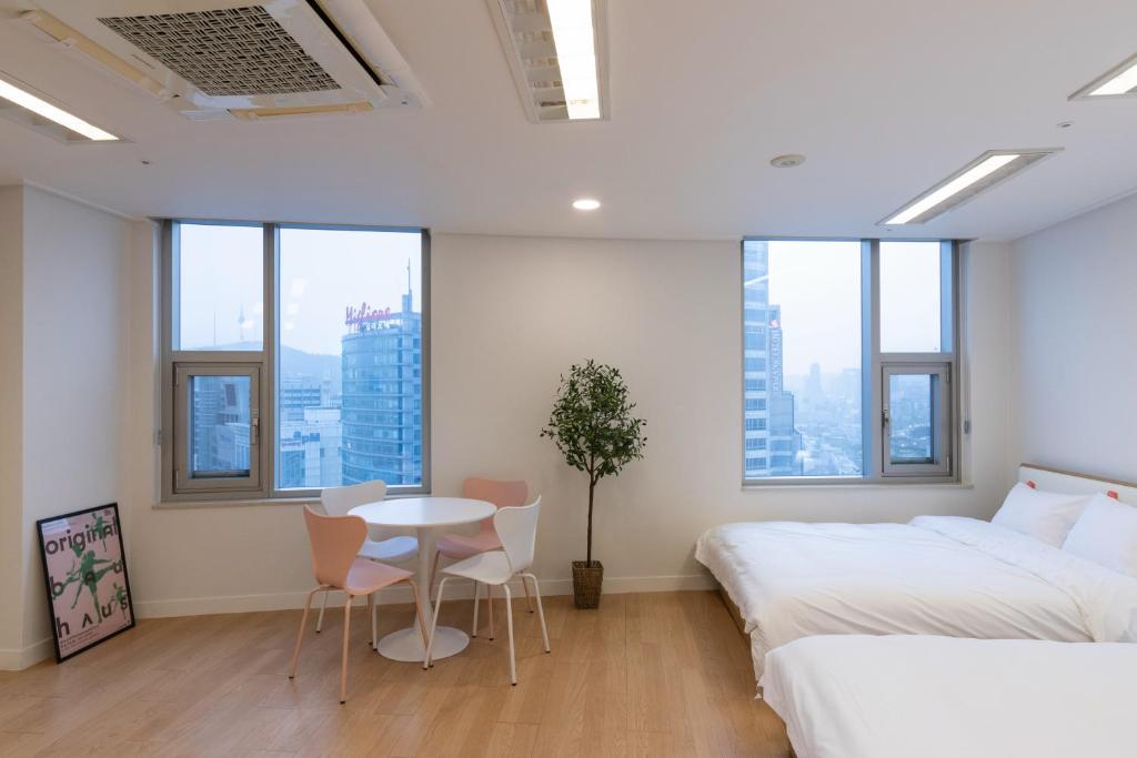 "GRAND OPENED" Maxtyle Guesthouse Dongdaemunにあるベッド