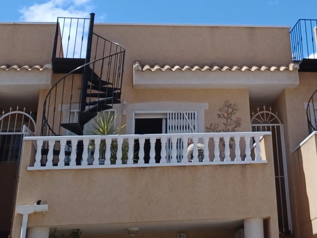 een trap van een huis met een balkon bij Reina Victoria 2 bed apartment in Rojales