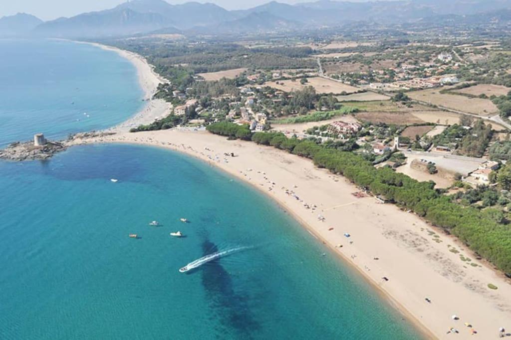 an aerial view of a beach with a boat in the water at Bari Sardo Le More Suite 3 in Bari Sardo