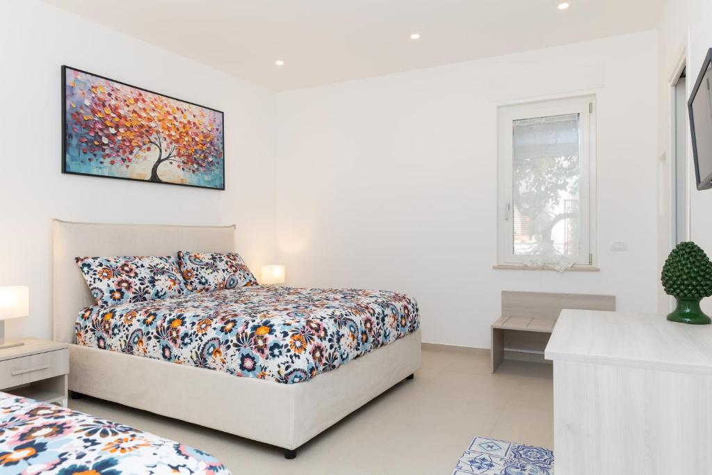 Postel nebo postele na pokoji v ubytování Villa Harmony Sorrento