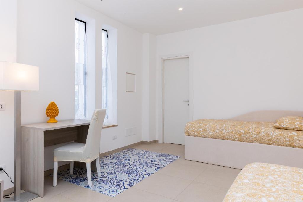 Postel nebo postele na pokoji v ubytování Villa Harmony Sorrento