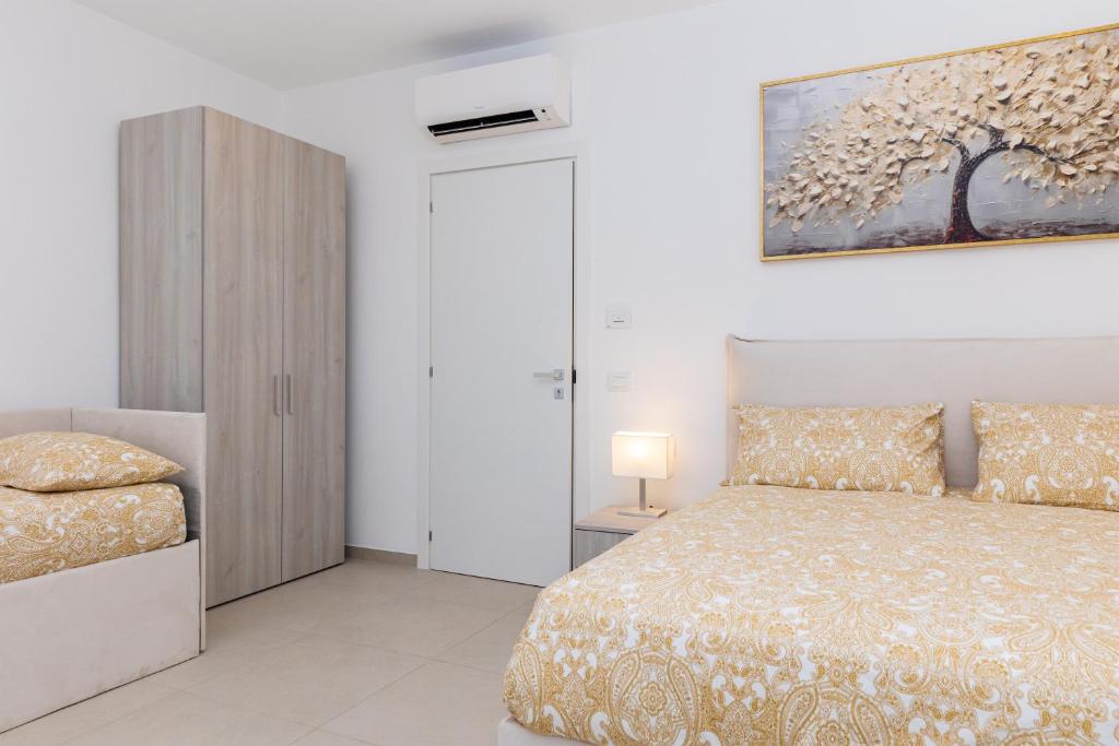 Postel nebo postele na pokoji v ubytování Villa Harmony Sorrento