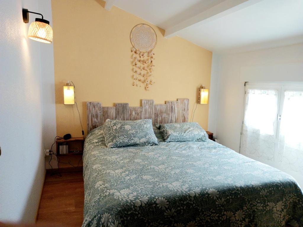 Ένα ή περισσότερα κρεβάτια σε δωμάτιο στο Casa Littoral