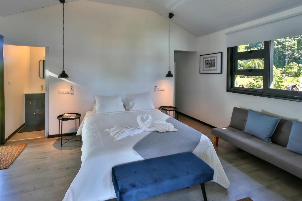 Postel nebo postele na pokoji v ubytování Sublime Tahiti Beach Retreat