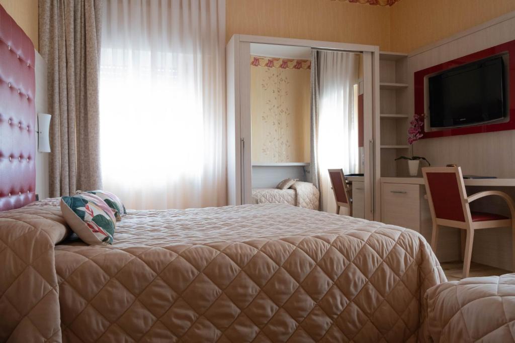 Postel nebo postele na pokoji v ubytování Hotel Vela D'oro ***S