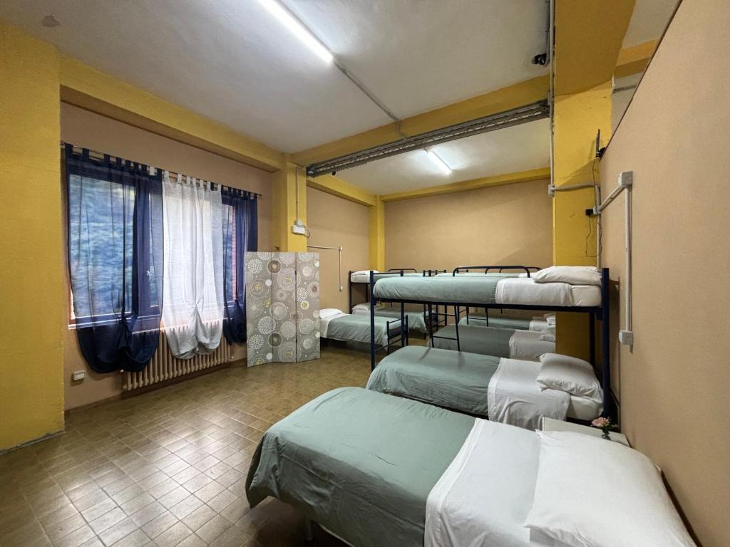 Postel nebo postele na pokoji v ubytování Ostello Bellavita