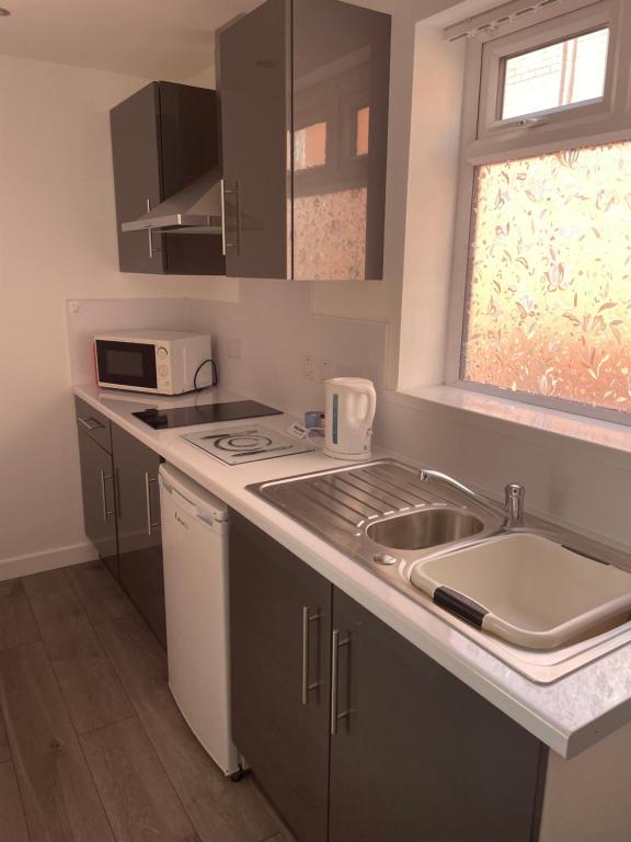 Kuchyň nebo kuchyňský kout v ubytování San Remo Apartments Blackpool