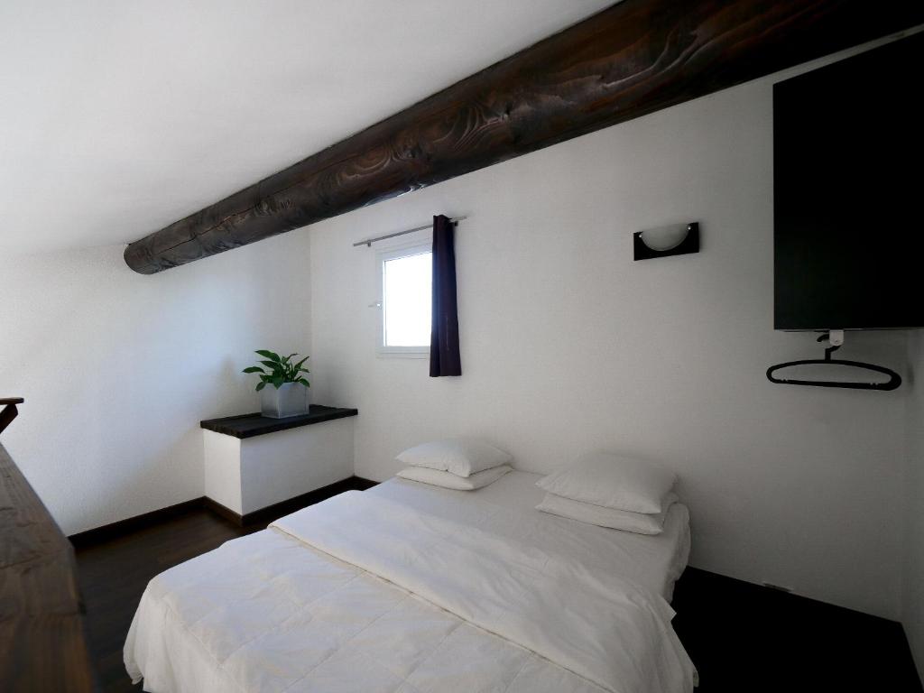 Ein Bett oder Betten in einem Zimmer der Unterkunft MAS MLS