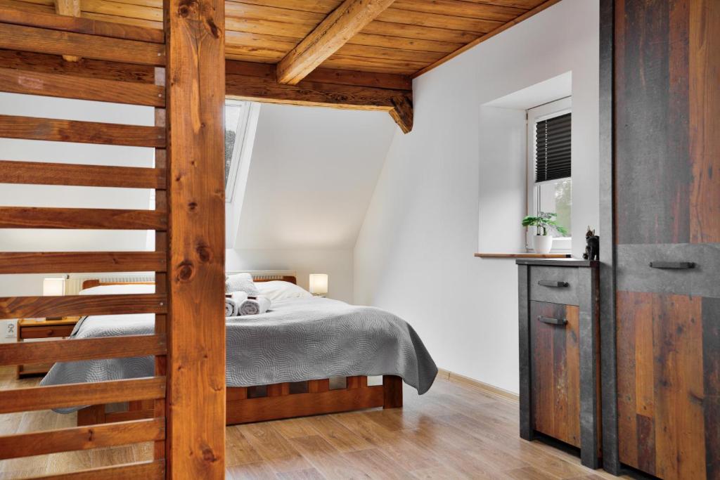 Postel nebo postele na pokoji v ubytování Apartmán Růžák