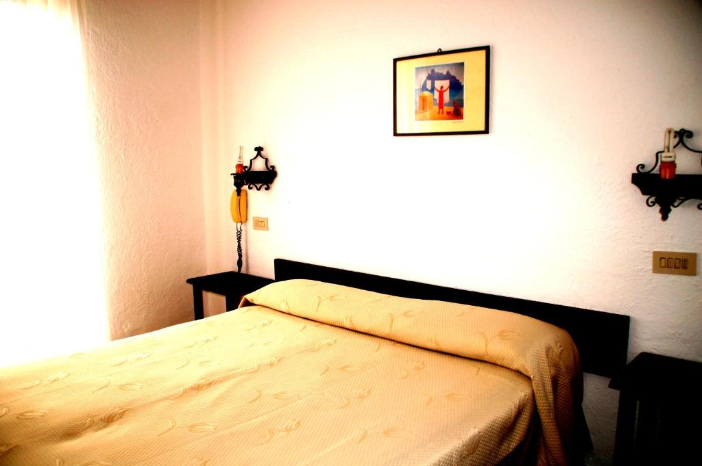Postel nebo postele na pokoji v ubytování Hotel Don Pedro