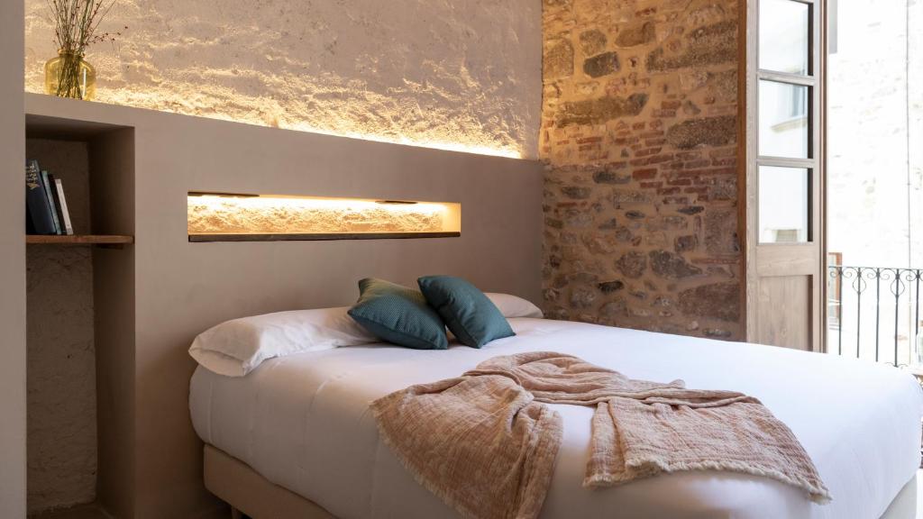Postel nebo postele na pokoji v ubytování Terra de vents