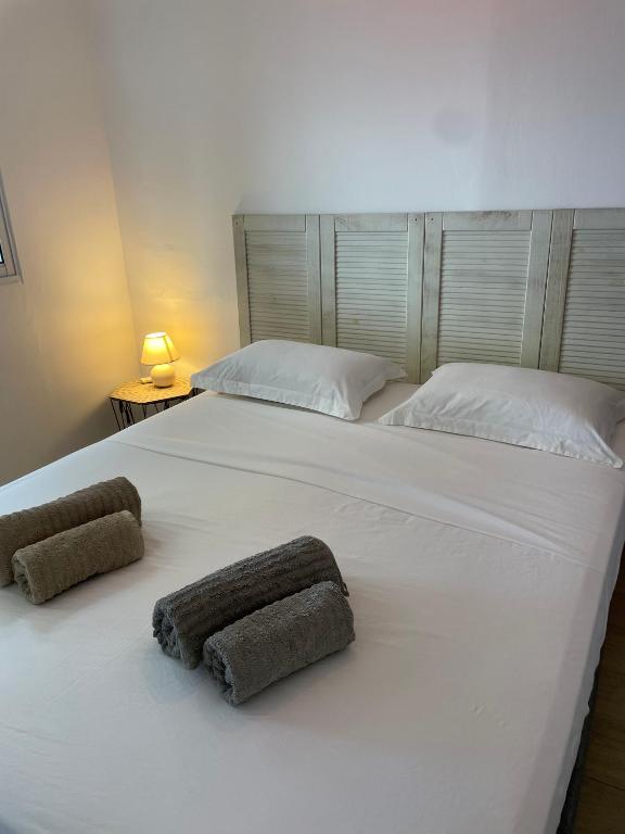 Postel nebo postele na pokoji v ubytování Sur La Mer - Appartement Deux chambres à Schoelcher