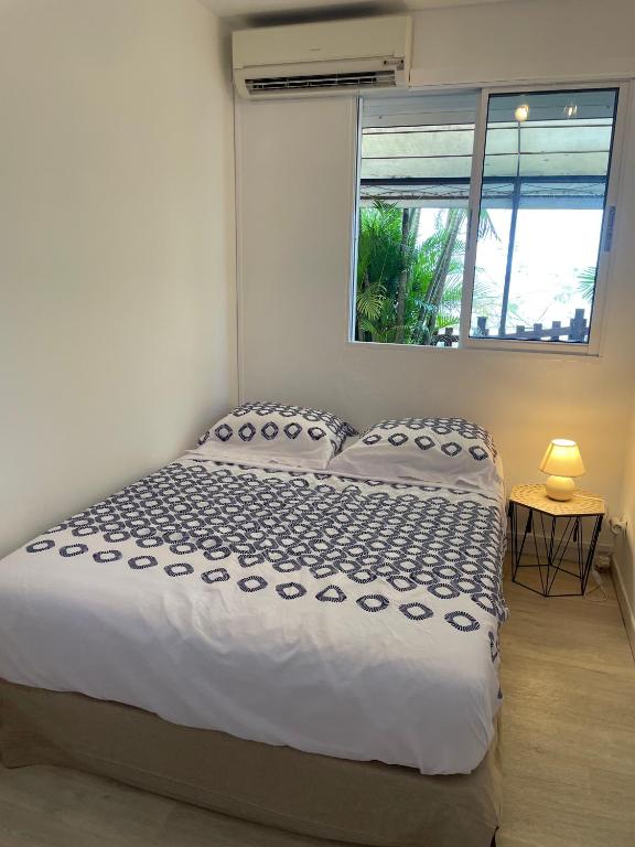 Postel nebo postele na pokoji v ubytování Sur La Mer - Appartement Deux chambres à Schoelcher