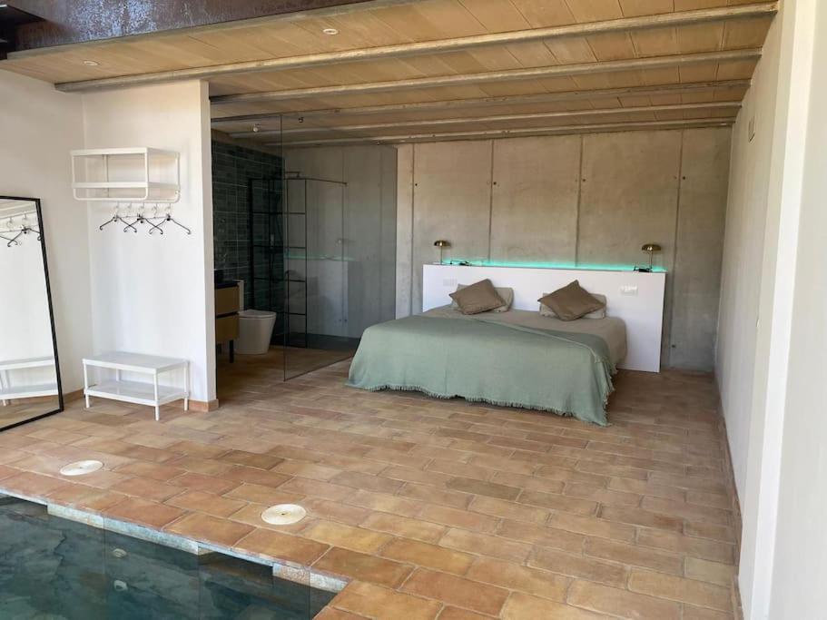 a bedroom with a bed in a room at Casa con piscina interior en Tamariu, Calella de Palafrugell in Palafrugell