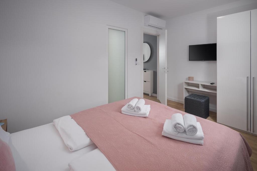 Postel nebo postele na pokoji v ubytování Lana Premium Residence