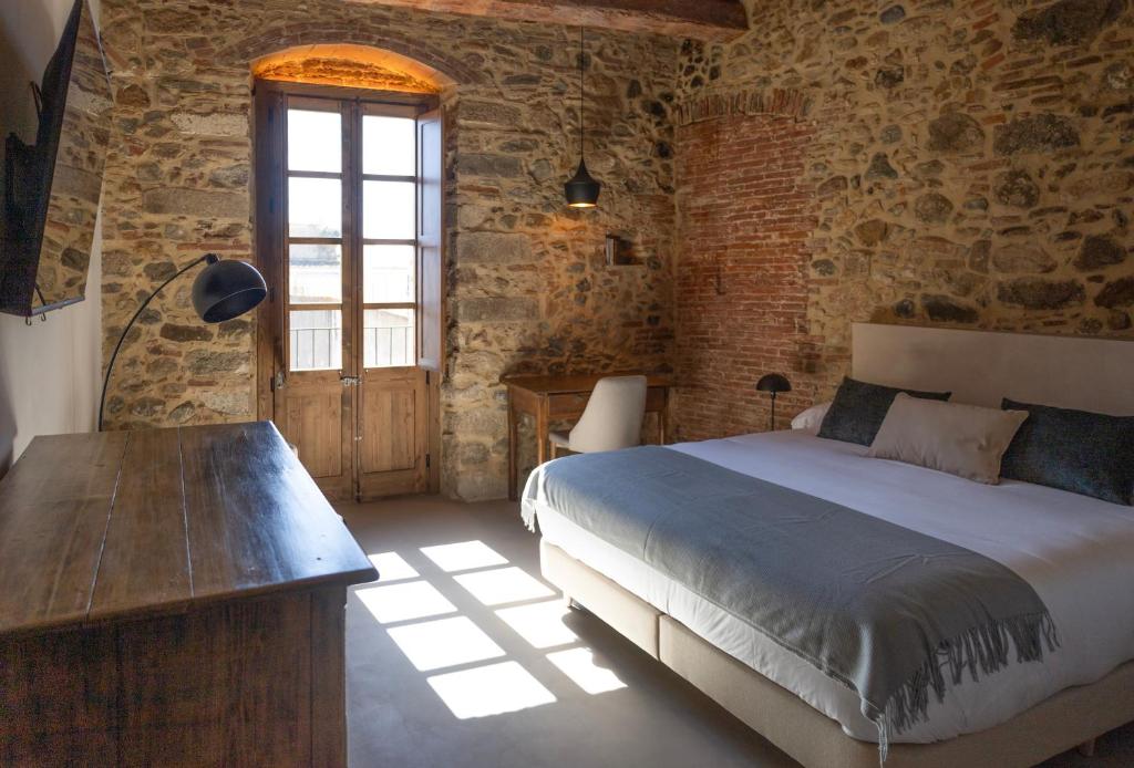 Postel nebo postele na pokoji v ubytování Terra de vents