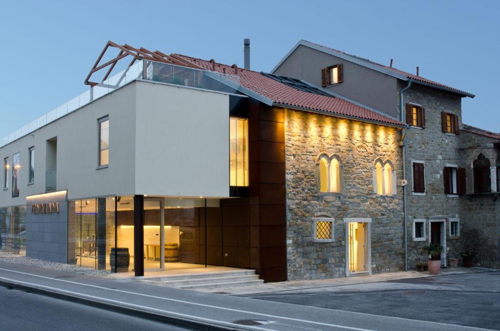 a building on the side of a street at VENEZIANA Boutique Hotel Superior in Koper