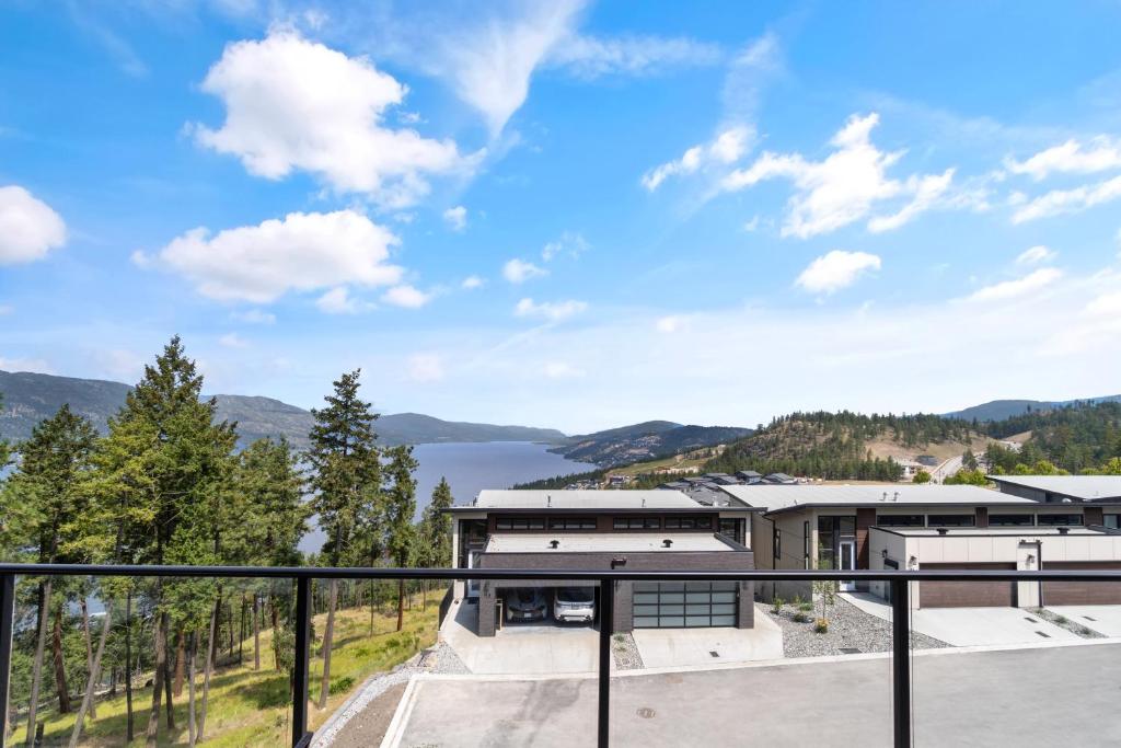a view from the balcony of a house with a view at Luxury Home with Amazing Lake Okanagan Views in Kelowna