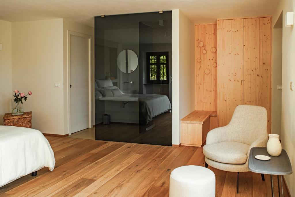 Postel nebo postele na pokoji v ubytování ghigorotto, suite&villa