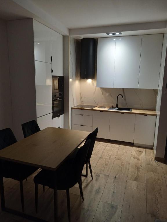 Kuchyň nebo kuchyňský kout v ubytování Apartament Tykocin