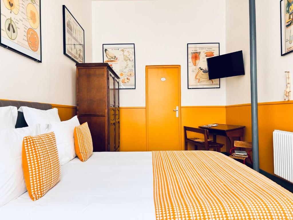 Postel nebo postele na pokoji v ubytování La Récréation - Chambres et Appartements